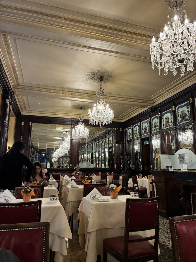 Opulent interior with crystal chandeliers, mirrors at Baratti & Milano, Turin