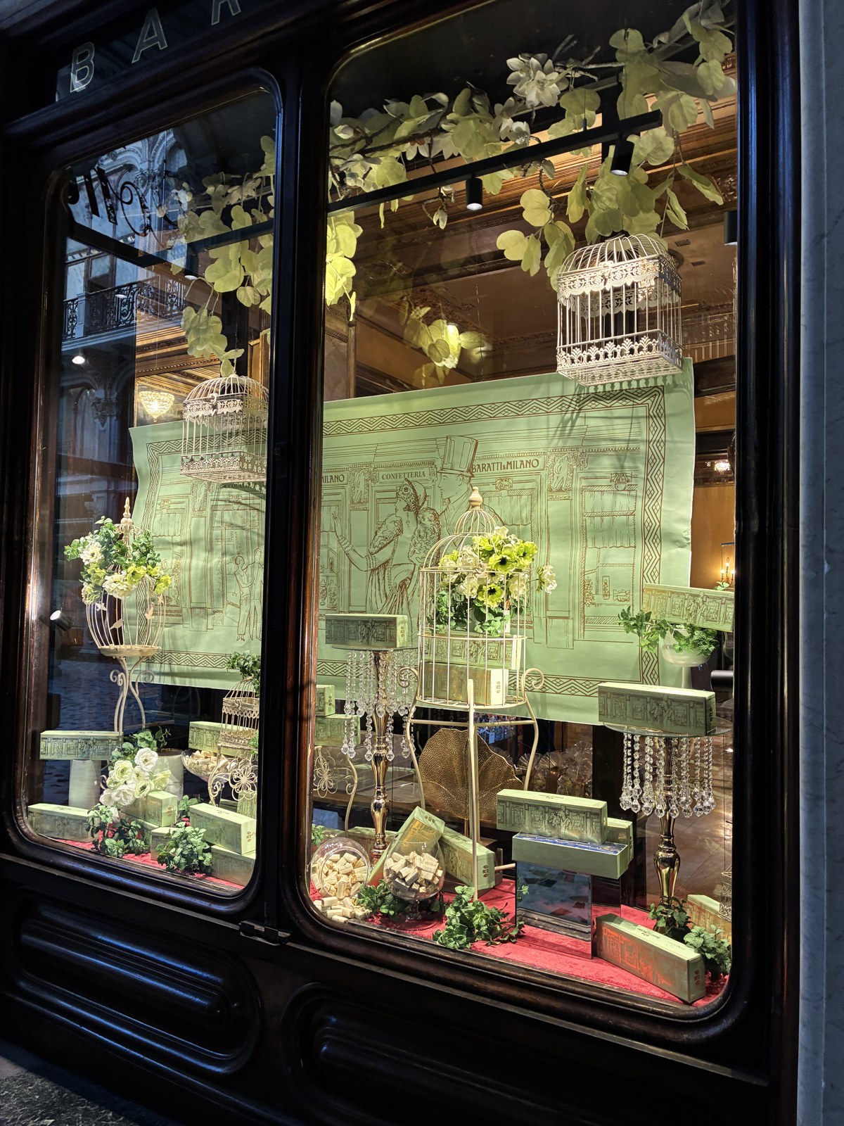 Decorative seasonal shop window display at a historic Turin cafè