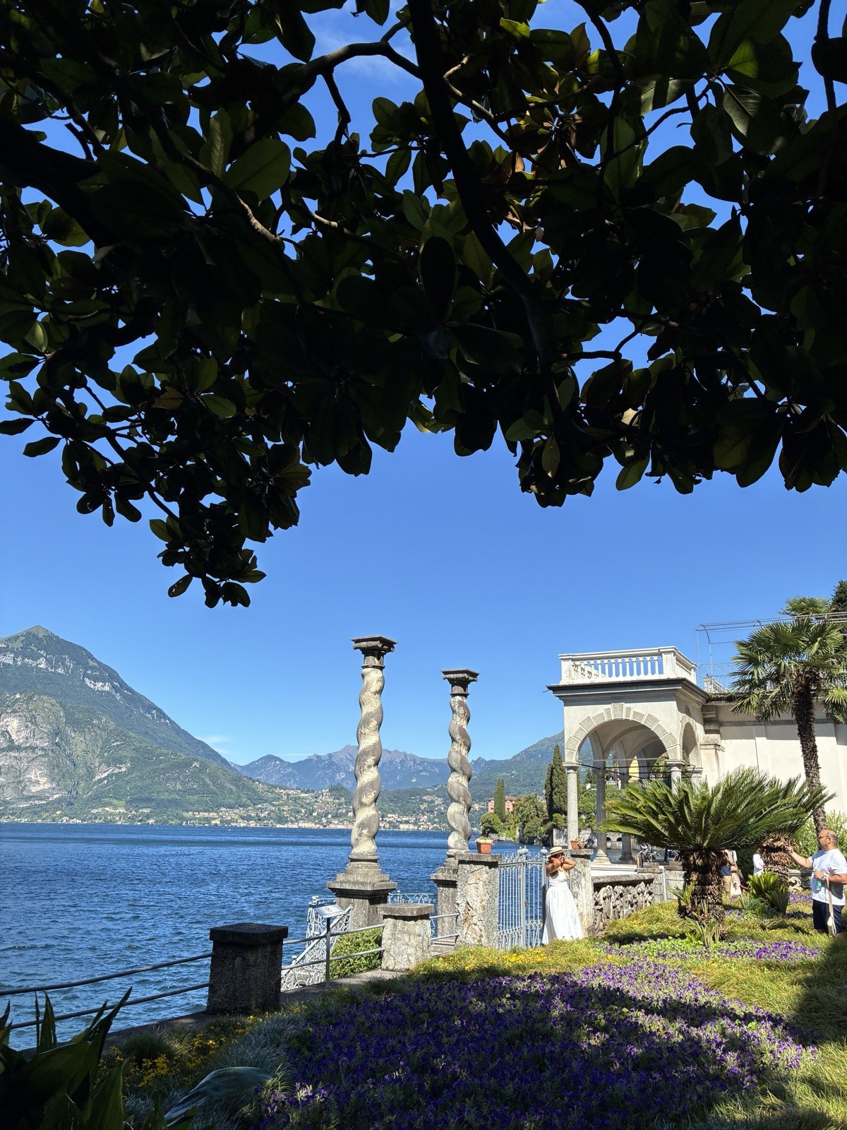 Lakefront promenade with flowers at Lake Como