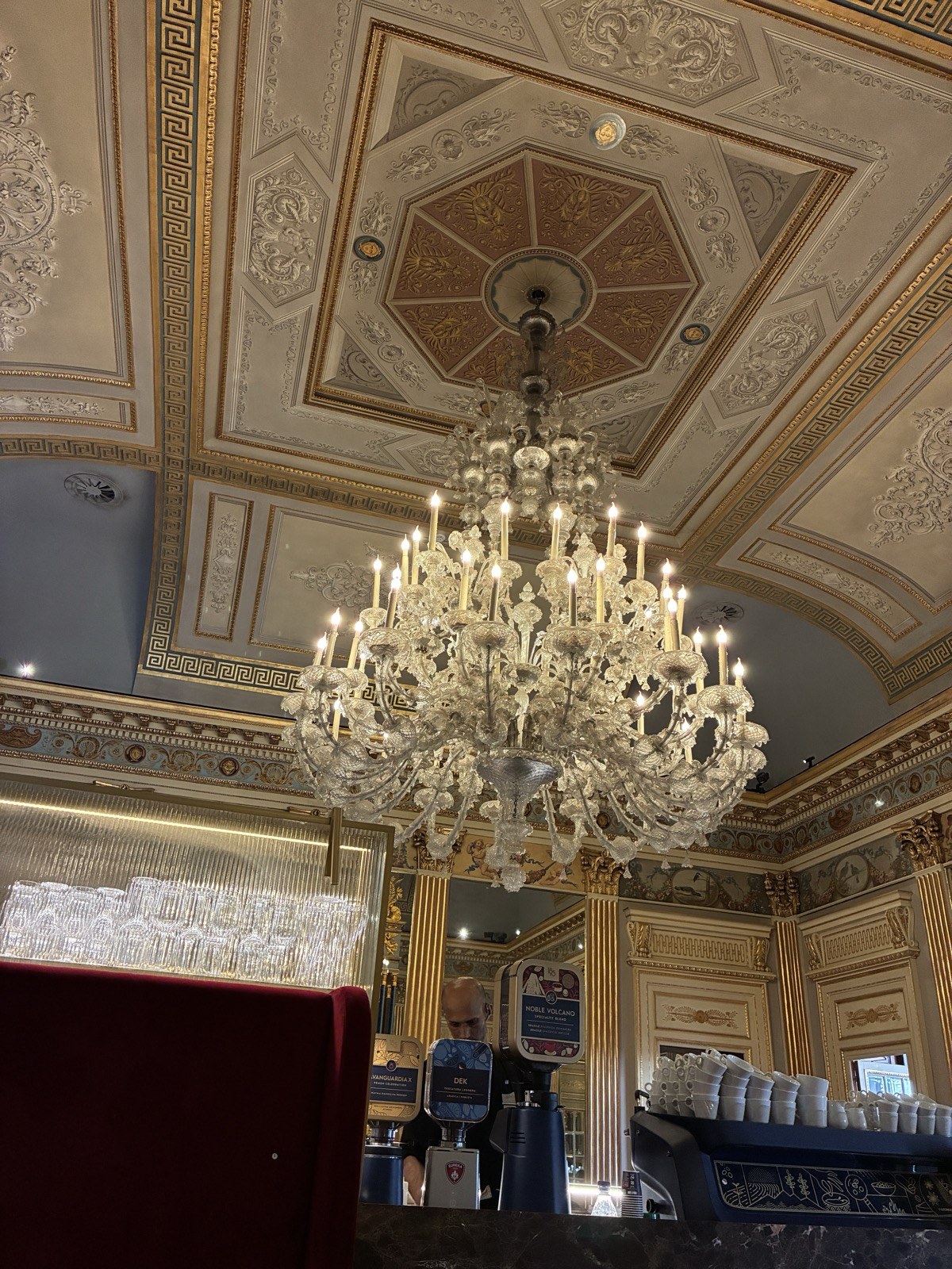 Frescoed ceiling and chandelier inside Caffè San Carlo