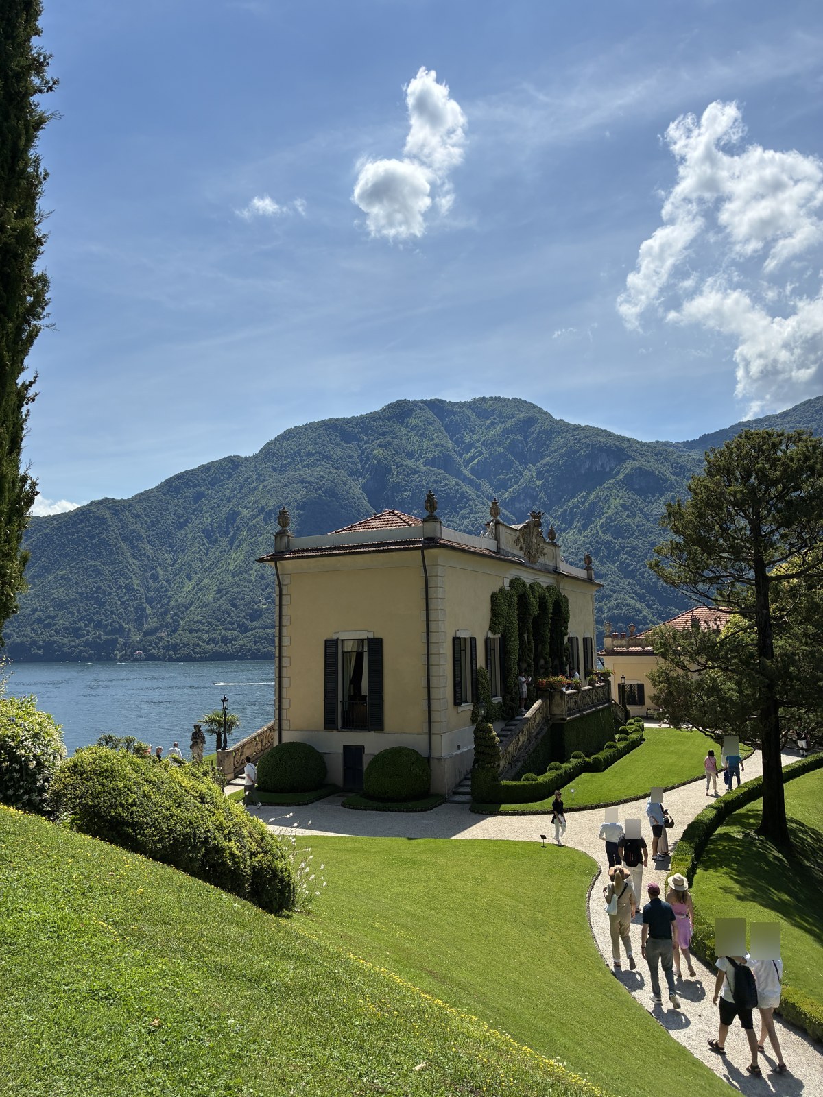 Garden pathway leading toward Villa del Balbianello on Lake Como