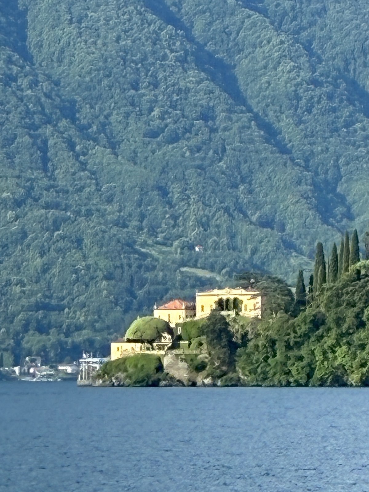 Villa del Balbianello on its wooded promontory seen from Lake Como