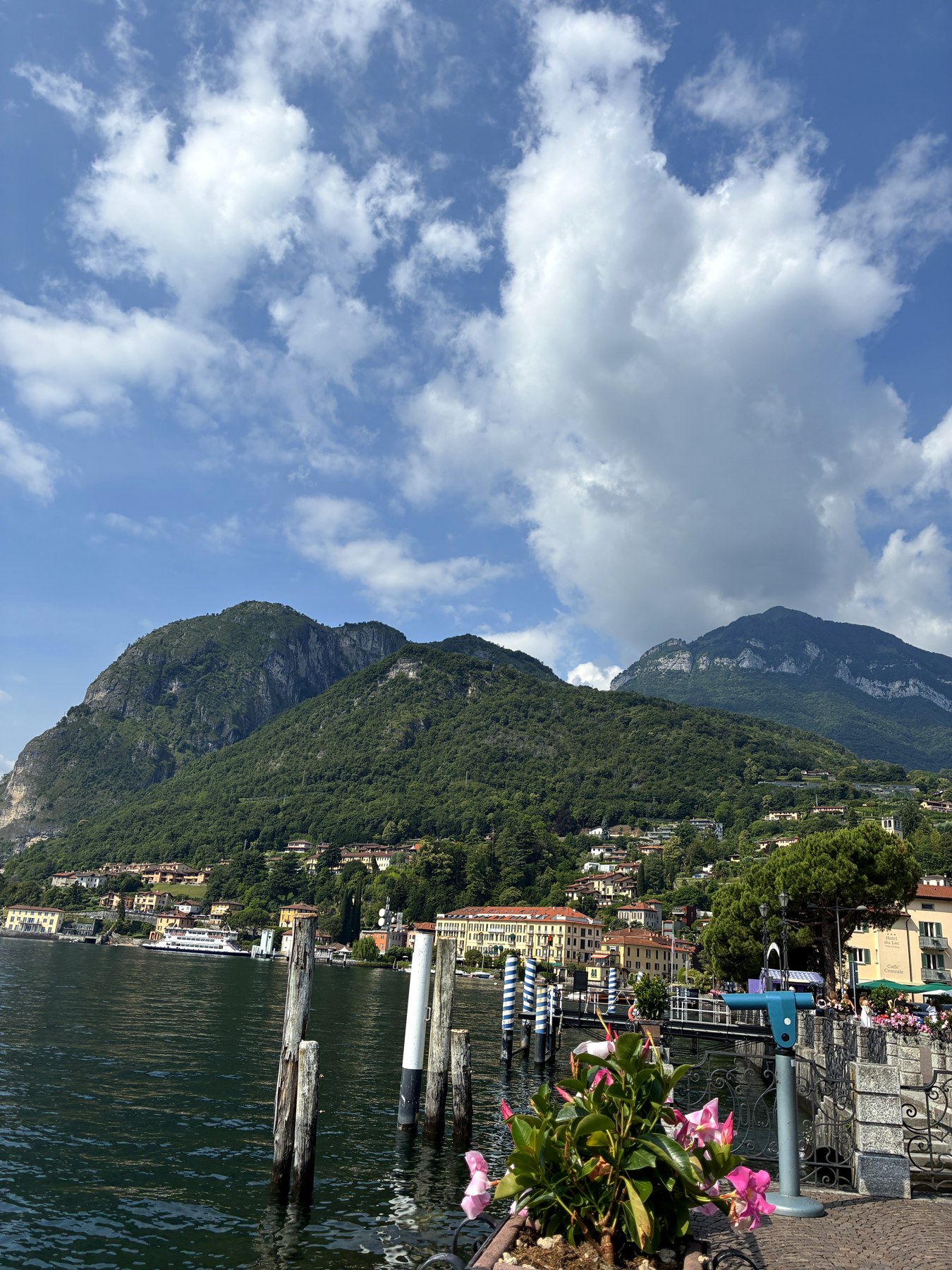 Lake Como town and mountains seen from the ferry dock