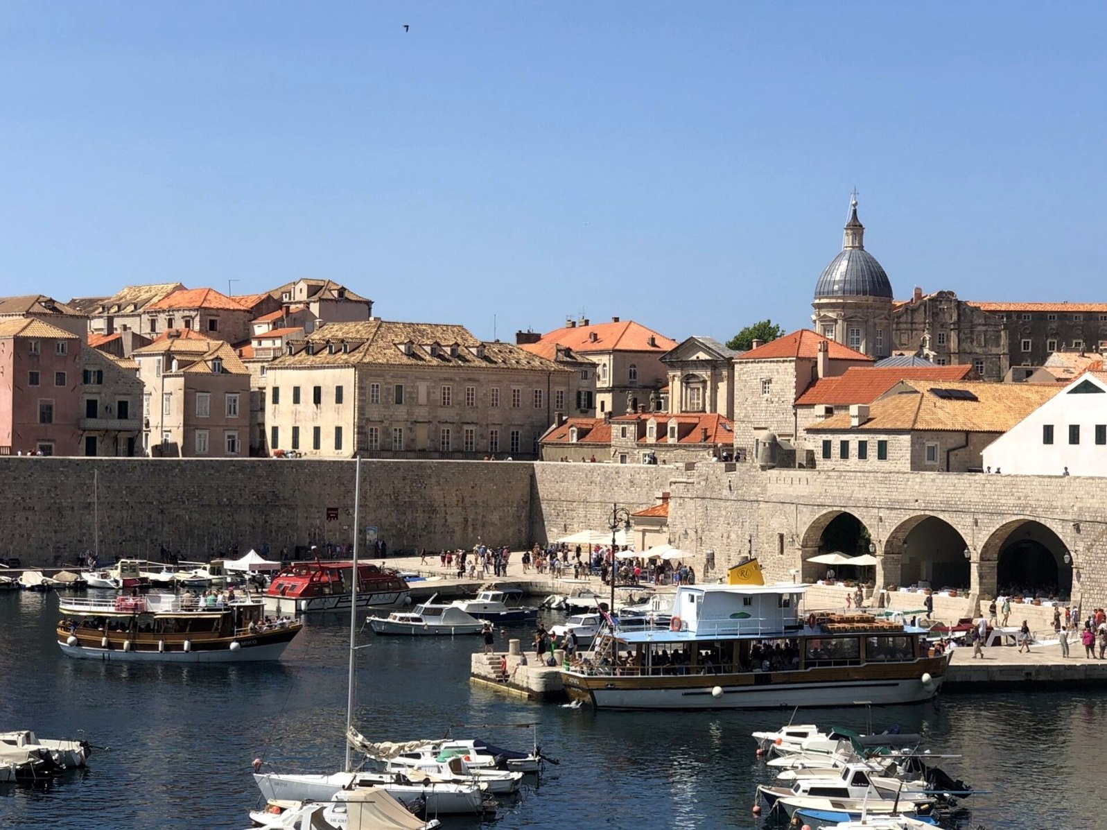 Dubrovnik city walls with terracotta rooftops above the sea