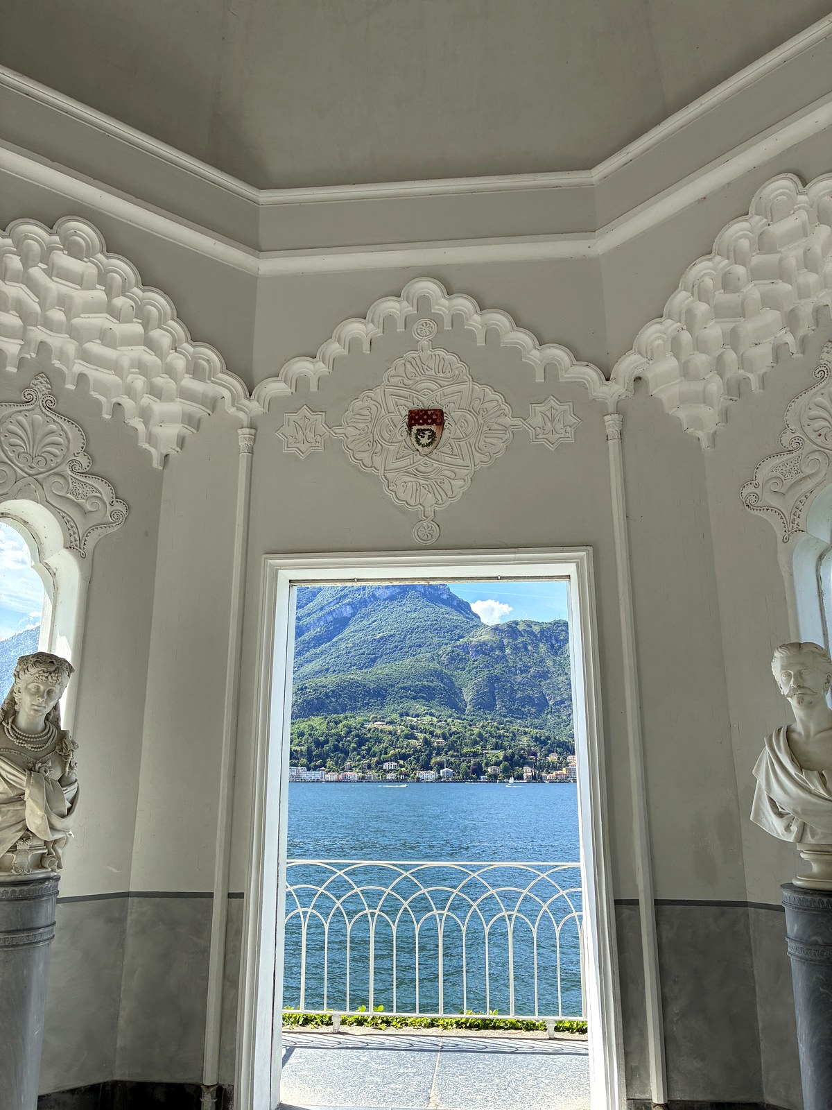 Lake Como framed by an ornate window at Villa Melzi in Bellagio