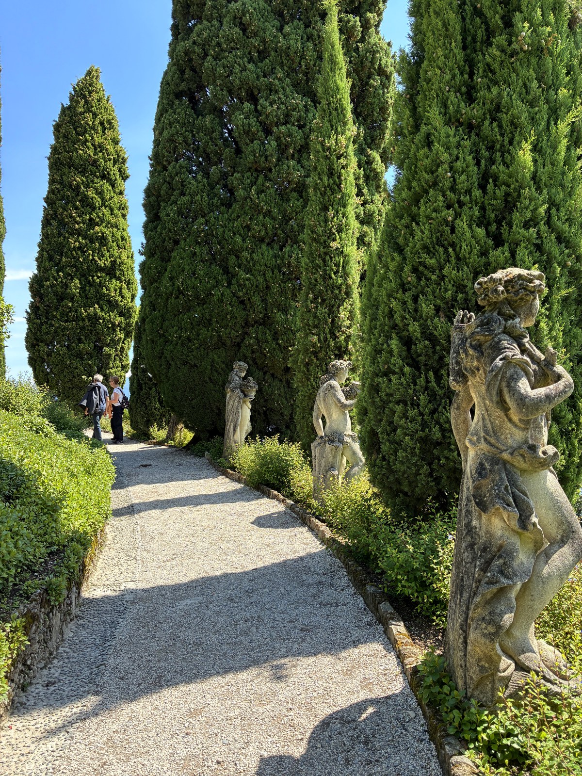 Cypress-lined garden path at Villa del Balbianello on Lake Como