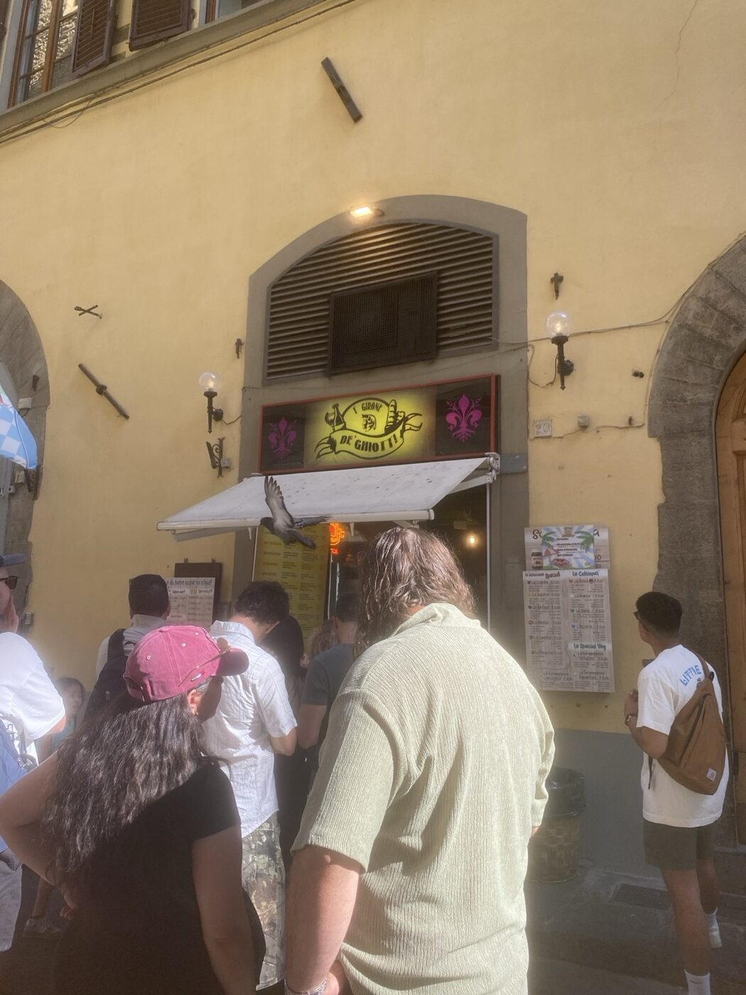 Queue outside a schiacciata shop on Via dei Cimatori, Florence