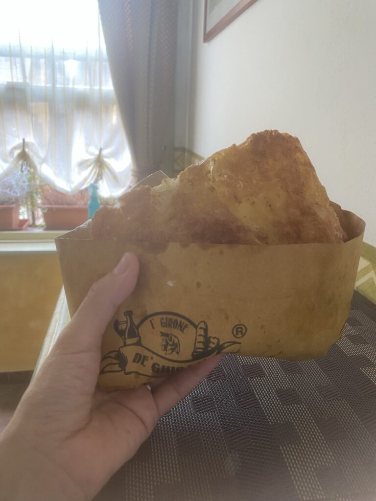 A schiacciata sandwich from I’ Girone de’ Ghiotti in Florence, held in one hand