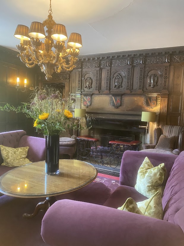 The violet lobby lounge at the Manor House, Castle Combe