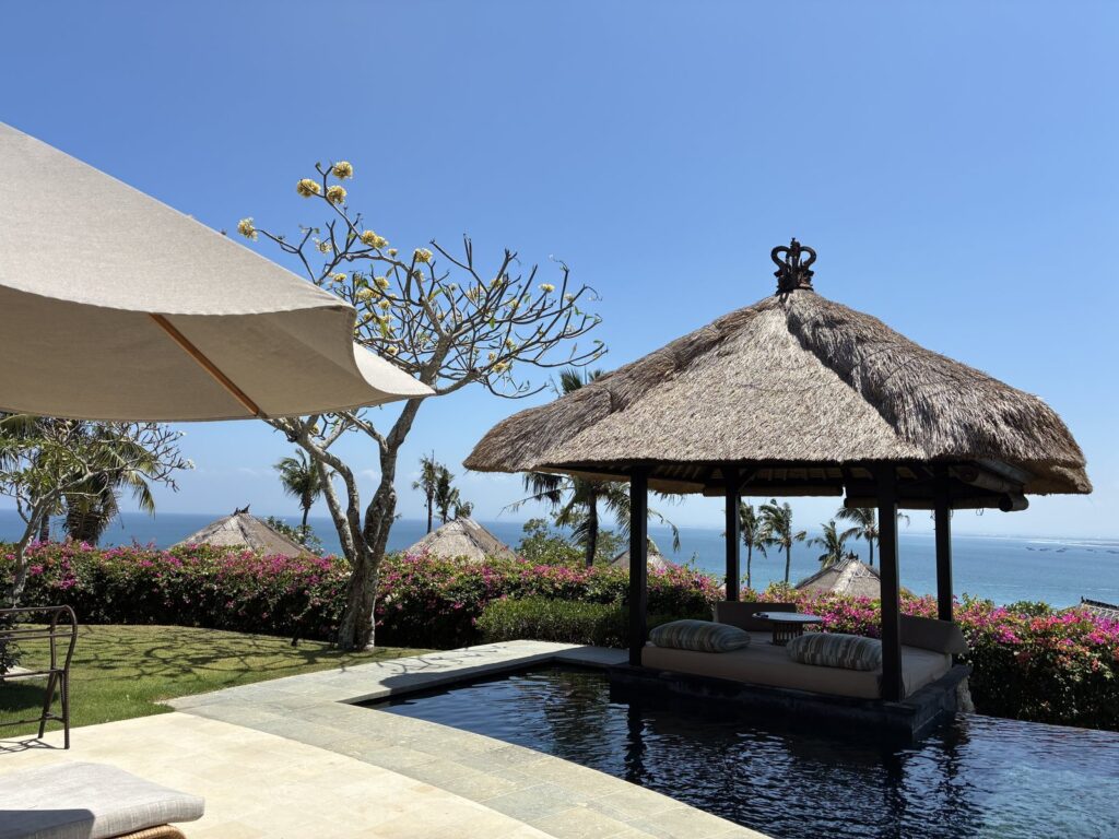 Bale, parasol, bougainvillea at an AYANA cliff villa
