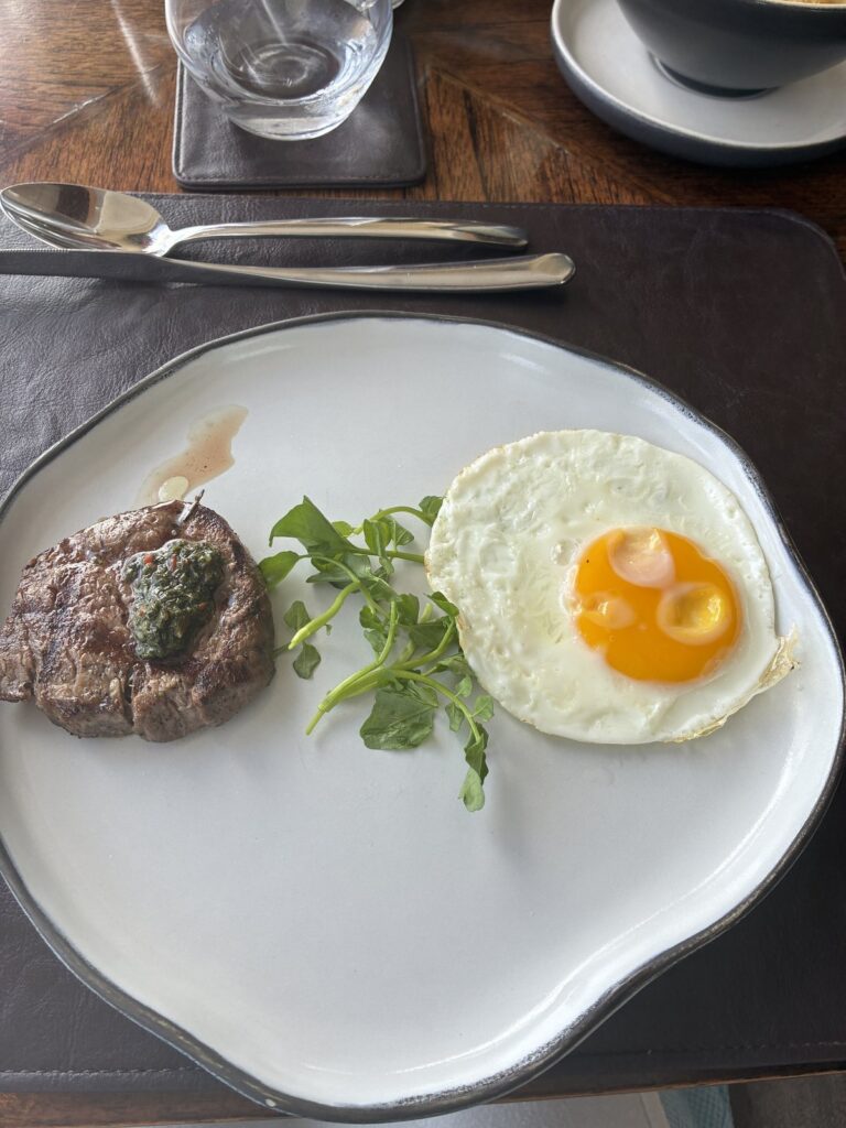 DAVA Signature steak with a fried egg at breakfast