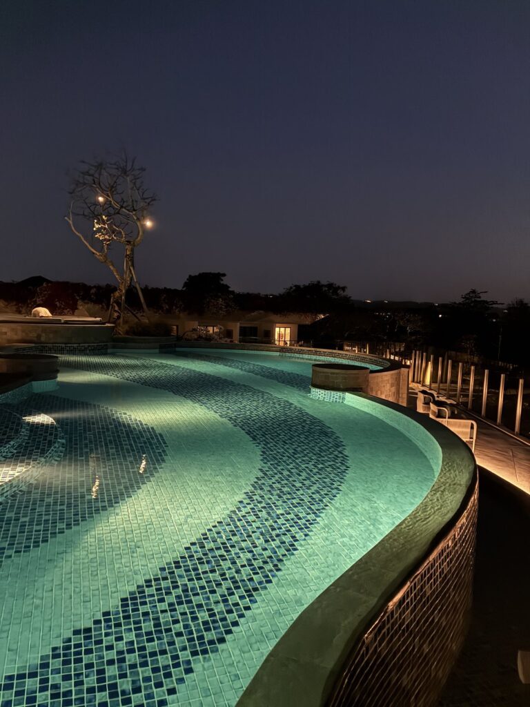Luna Rooftop Bar pool lit at night